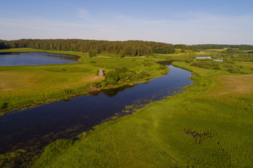 View of the Sorot river valley on a sunny June morning (shot from a quadrocopter). Mikhailovskoye, Pushkin Mountains