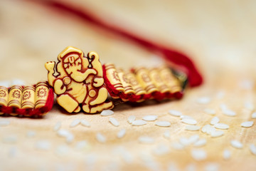 Closeup Of Lord Ganesha Wristband On A Wooden Surface