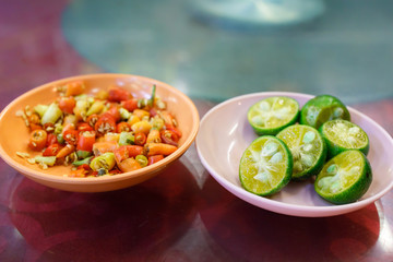 Plate of Chopped Chilli and Plate of Cut Limes
