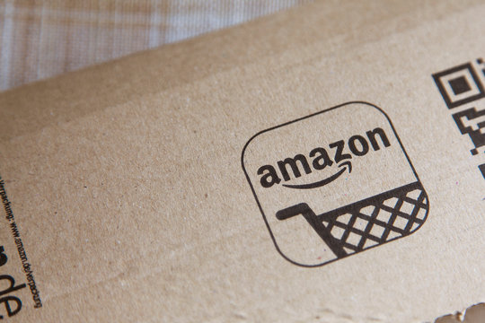 OXFORD, UK - MAY 22nd 2017: Amazon logo on a parcel. Amazon is the largest online retailer in the world and was founded in 1994