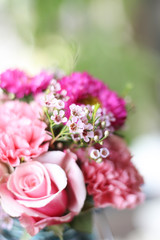pink roses and flower bouquet in blue mason jar