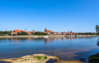 Fototapeta na wymiar Panoramic view of Torun city and Wisla river in sunny day. Poland, summer 2019