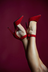 legs in red shoes