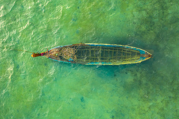 Fototapeta premium a small fishing boat drowned in the sea
