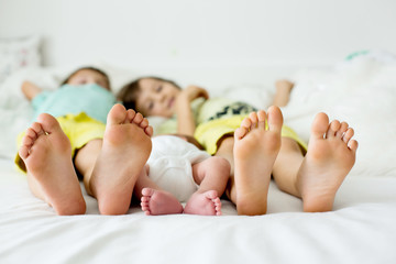 Little baby boy feet, baby lie down in bed in the afternoon © Tomsickova