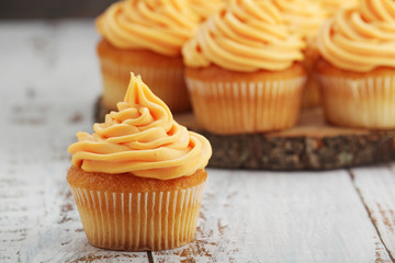 Cupcakes with orange icing on top