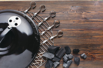 Close-up of barbecue appliance with skewer and coal