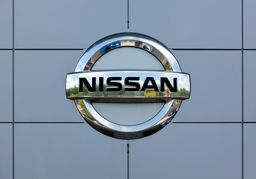Dusseldorf, Germany - June 12, 2011: Nissan logo at the wall of car dealer's building.