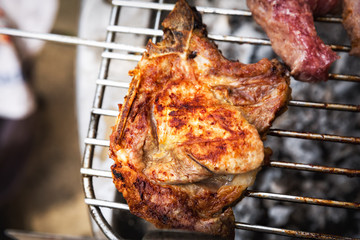 closeup of grilled chicken meat on the grill.