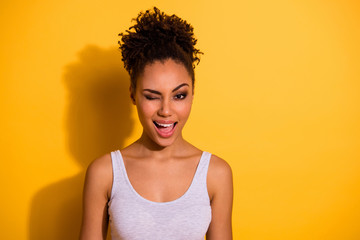 Close up photo beautiful attractive she her dark skin lady winking one eye excited amazed cunning...