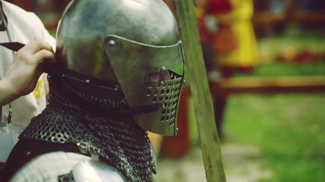 Somebody making sure that the armour is applied correctly.