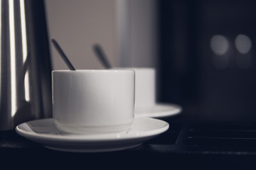 two white ceramic cups with coffee