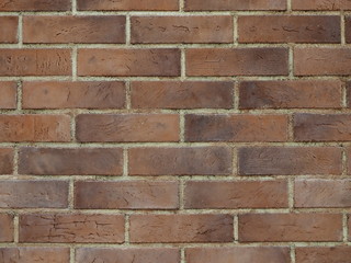 Brown brick wall background with yellow lines