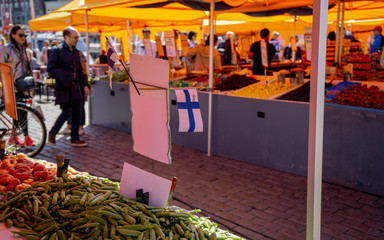 HELSINKI, FINLAND - JULY 27, 2019: Market Square (Kauppatori) market selling fruits and wegetables....