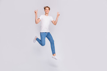 Full body photo of jumping high guy showing v-sign symbol wear casual outfit isolated white background