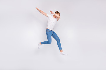 Fototapeta na wymiar Full body photo of jumping high guy chilling on cool party wear casual outfit isolated white background
