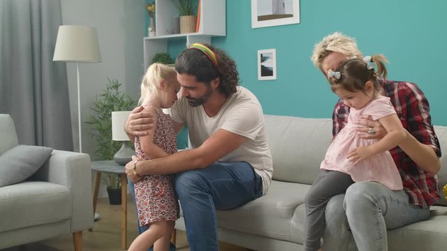 dad hug daughter who is upset and crying