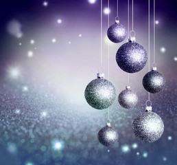 Fototapeta na wymiar Christmas abstract background with blue glistening balls.