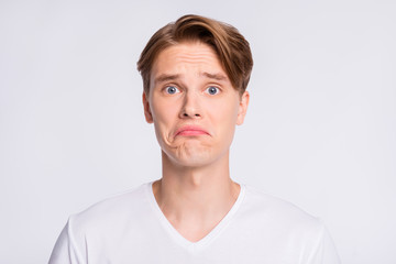 Close-up portrait of his he nice cute attractive desperate guy bad mood news mistake isolated over...