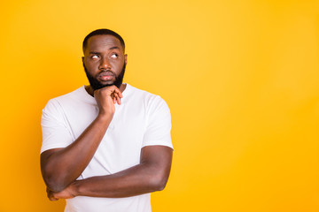 Close up photo of dark skin guy looking up empty space not sure with decision wear casual outfit...