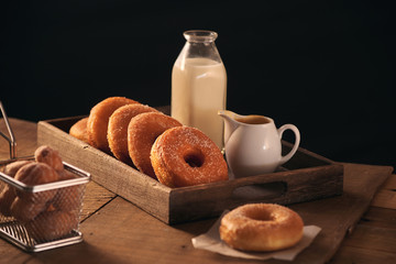 Sugar donuts with a glass of milk