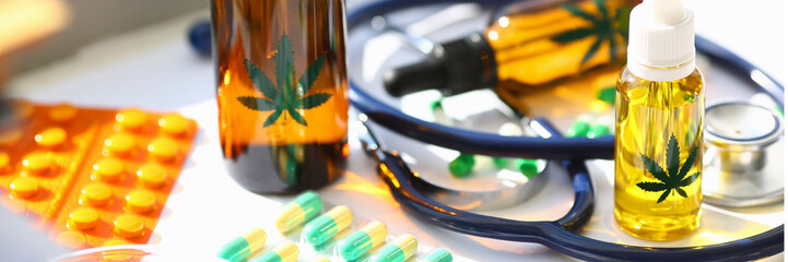 Marijuana oil medicinal pills with stethoscope