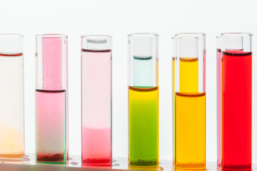 Glass laboratory chemical test tubes with liquid for analysis close up