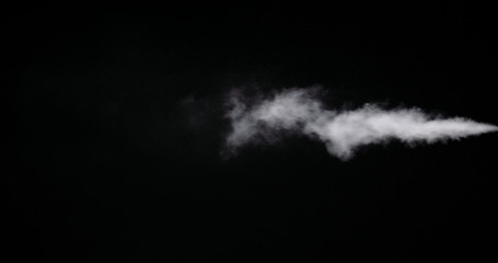 White smoke trail isolated on black background.