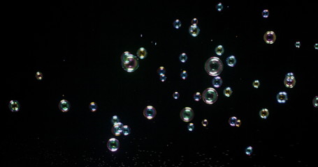 Floating bubbles isolated over a black background
