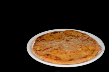 Alu Paratha in Plate with Black Background