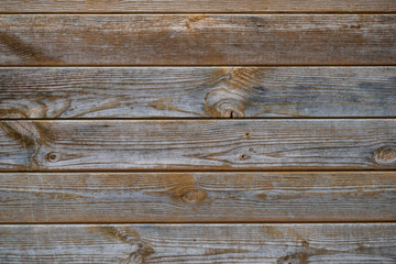 Fototapeta premium closeup rustic wooden desk wall. background with nice texture with grey, red and orange colours