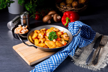 a delicious fried potato and shrimp pan