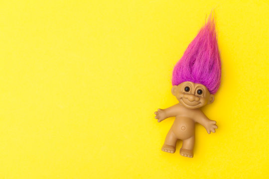 LONDON, UK - DECEMBER 4th 2017: An original troll plastic toy figure with bright coloured hair. First produced in Denmark by Thomas Dam