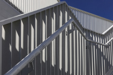 Pattern of  stair railing against a blue sky