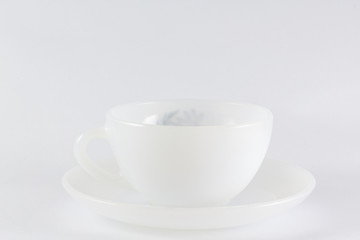 Obraz na płótnie Canvas a white cup. On a white background.
