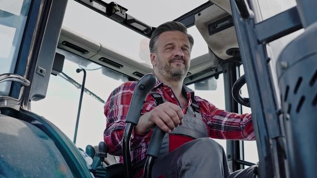 Farmer working on a modern tractor