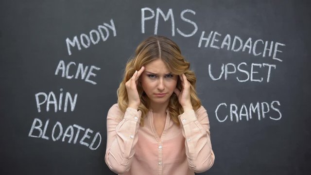 Woman suffering headache due to imaginary problems in pms, hormone imbalance