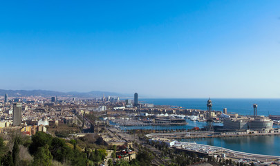 Fototapeta na wymiar Landscape photo of the Barcelona marina bay and seaport. View from Montjuïc