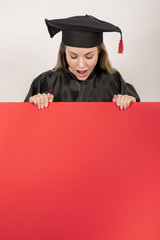 Graduate girl holding red placard mock-up