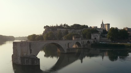 Aerial view in Avignon France during the sunrise with the Papal Palace (Palais des Papes) and the Avignon Bridge, Pont d'Avignon or Pont St-Bénézet
