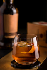 whiskey drink in a glass with a piece of ice