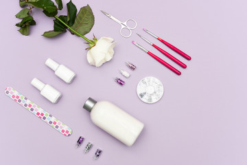 A set of cosmetic tools for manicure and pedicure on a weyt background