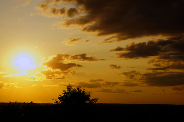 Fototapeta na wymiar Sunrise and amber colored sky