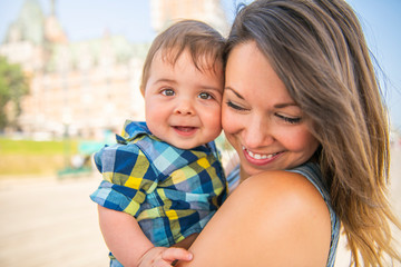 A Mother with her baby son on a urban background