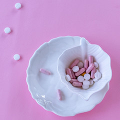 Pills in the dish. Concepts - what we eat, hidden ingredients, addictions.