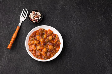 vegetable grains peas soup in tomato sauce