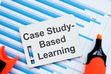 Text sign showing Case Study-Based Learning. The text is written on a small wooden board with...