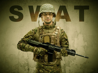 Uniformed armed soldier with damaged wall background