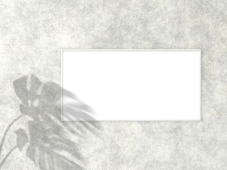 1x2 horizontal White frame for photo or picture mockup on concrete background with shadow of monstera leaves. 3D rendering.