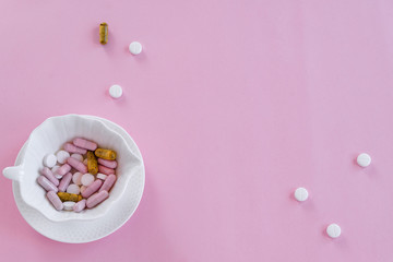Pills in the dish. Concepts - what we eat, hidden ingredients, addictions.